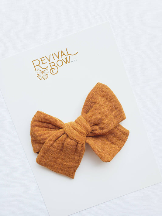 Large Pinwheel Bow on Alligator Clip • Burnt Orange